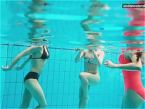 three nude gals have joy underwater