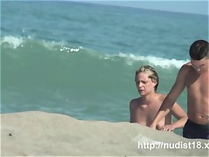 nude beach hidden cam shoots a torrid honey with a hidden web cam